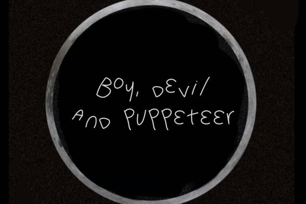 Boy, devil and puppeteer